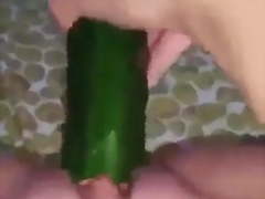 Horny Algerian puts cucumber in pussy.