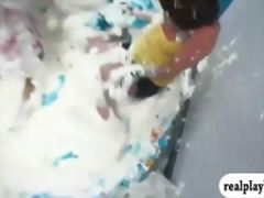 Roommates tag of war in inflatable pool